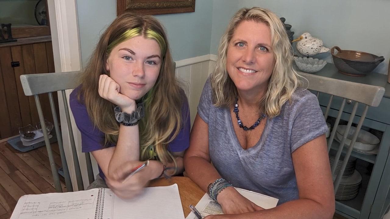 Connections Academy student and her mom studying together at a table 